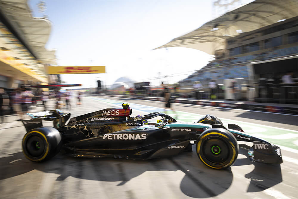 Formula 1 mercedes car driving out of the boxing stop