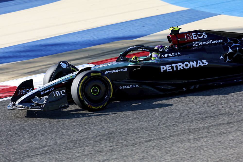 Formula 1 mercedes car driving on the race track